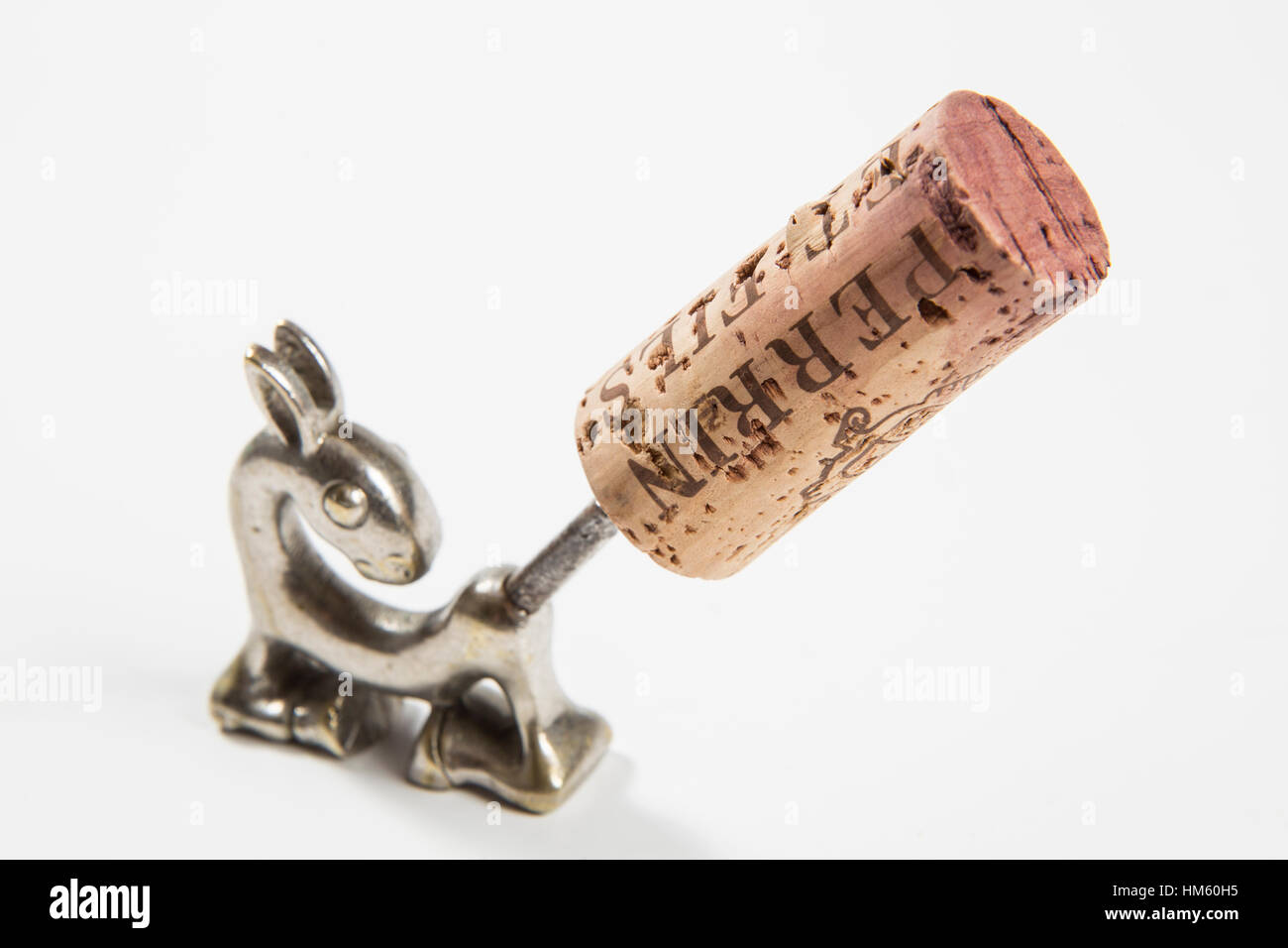 Wine cork with a corkscrew inserted Stock Photo