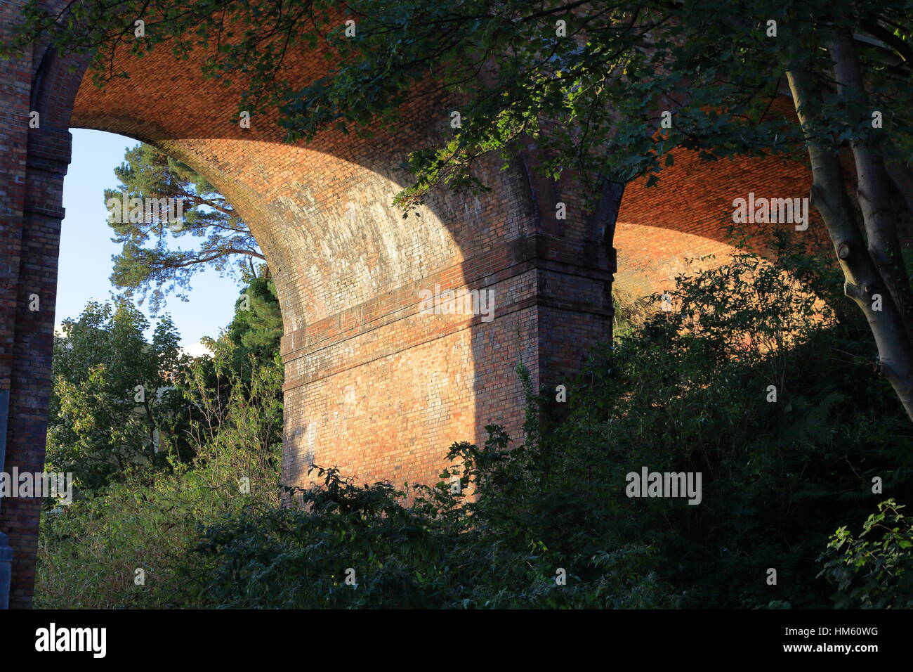 Glowing brickwork on underside of Victorian railway viaduct across the