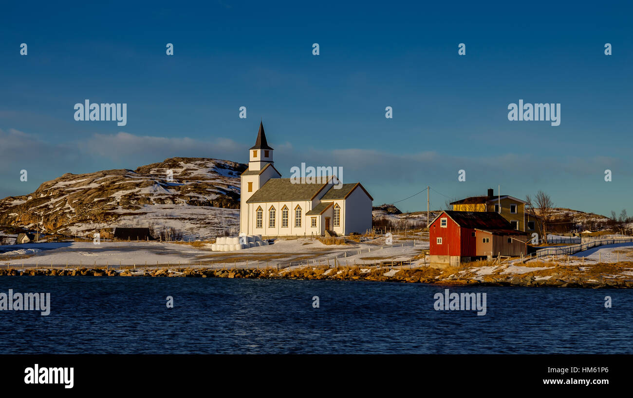 Northern Norway in winter with the church of Hillesøy and coastal landscape. Near the city of Tromsø. Stock Photo