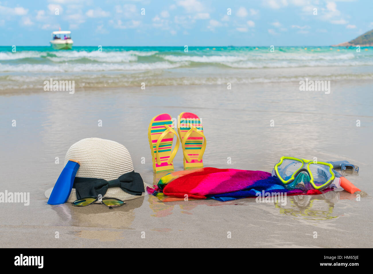 Sunglasses, sun cream and hat on white sand beach Stock Photo Alamy