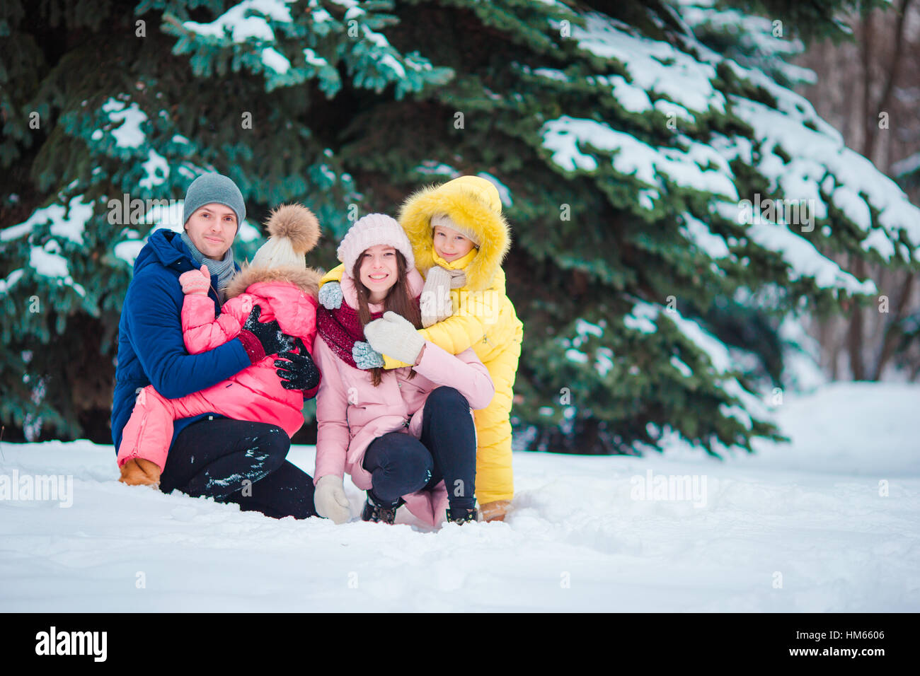 Happy family enjoy winter snowy day Stock Photo - Alamy