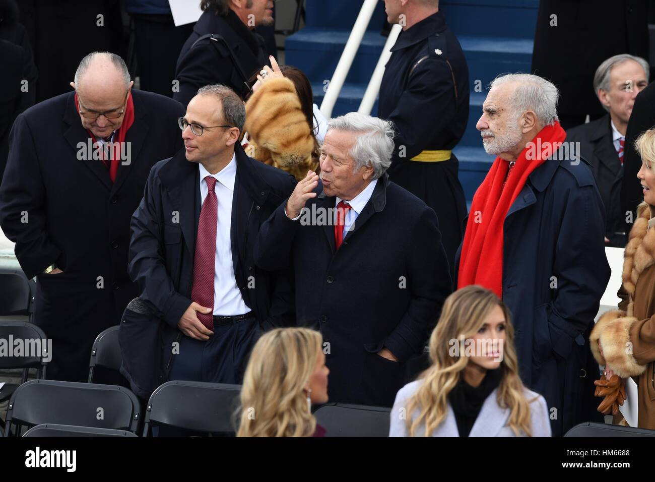 New England Patriots owner Robert Kraft, center, blows a kiss after arriving for the President Inaugural Ceremony on Capitol Hill January 20, 2017 in Washington, DC. Donald Trump became the 45th President of the United States in the ceremony. Standing with Kraft are Rudy Giuliani, left, son Patrick Kraft and Billionaire Carl Icahn, right. Stock Photo