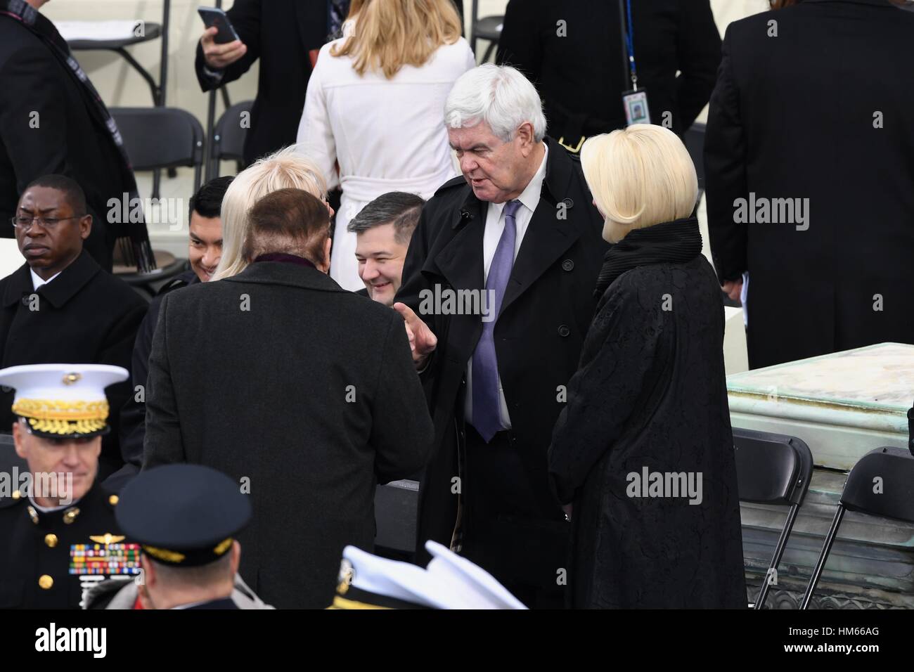 Former House Speaker Newt Gingrich and his wife Callista Gingrich chat with American casino magnate Sheldon Adelson before the start of the Inauguration of President-elect Donald Trump as the 45th President on Capitol Hill January 20, 2017 in Washington, DC. Stock Photo