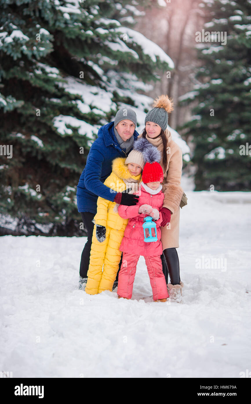 Happy family enjoy winter snowy day Stock Photo - Alamy