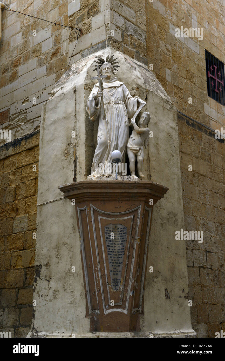 francis of assissi statue sculpture street corner streets Valletta Malta religion religious catholic iconography RM World Stock Photo