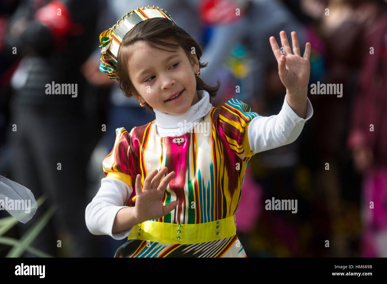 Girls dancing traditional oriental dance during the celebration of Navruz in Khujand city in Republic of Tajikistan Stock Photo