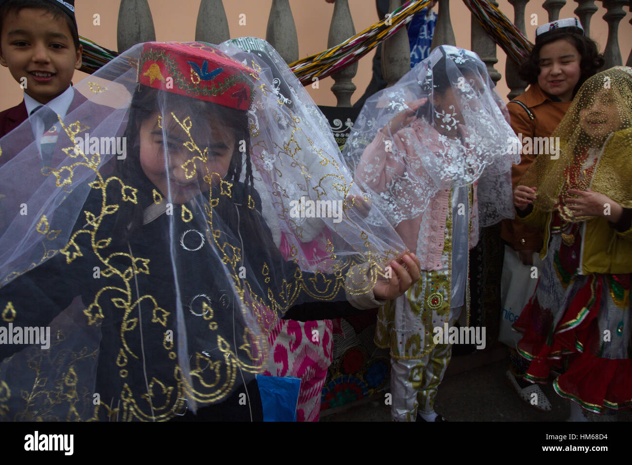 Girls dancing traditional oriental dance during the celebration of Navruz in Khujand city in Republic of Tajikistan Stock Photo