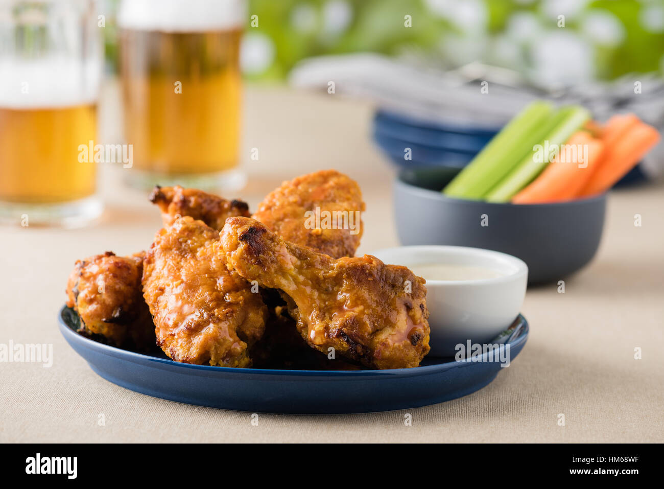 Hot wing with celery carrot sticks at beer garden Stock Photo Alamy