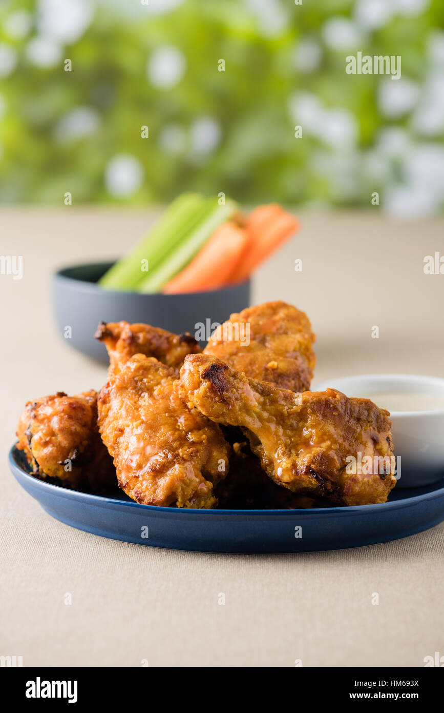 Hot wing with celery carrot sticks at beer garden Stock Photo Alamy