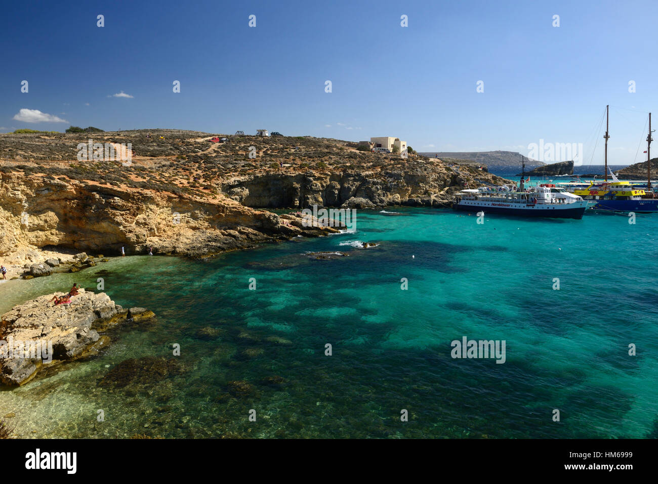 The Blue Lagoon Comino Island azure sea seas sky crystal clear water waters Mediterranean ocean tourism Malta RM World Stock Photo
