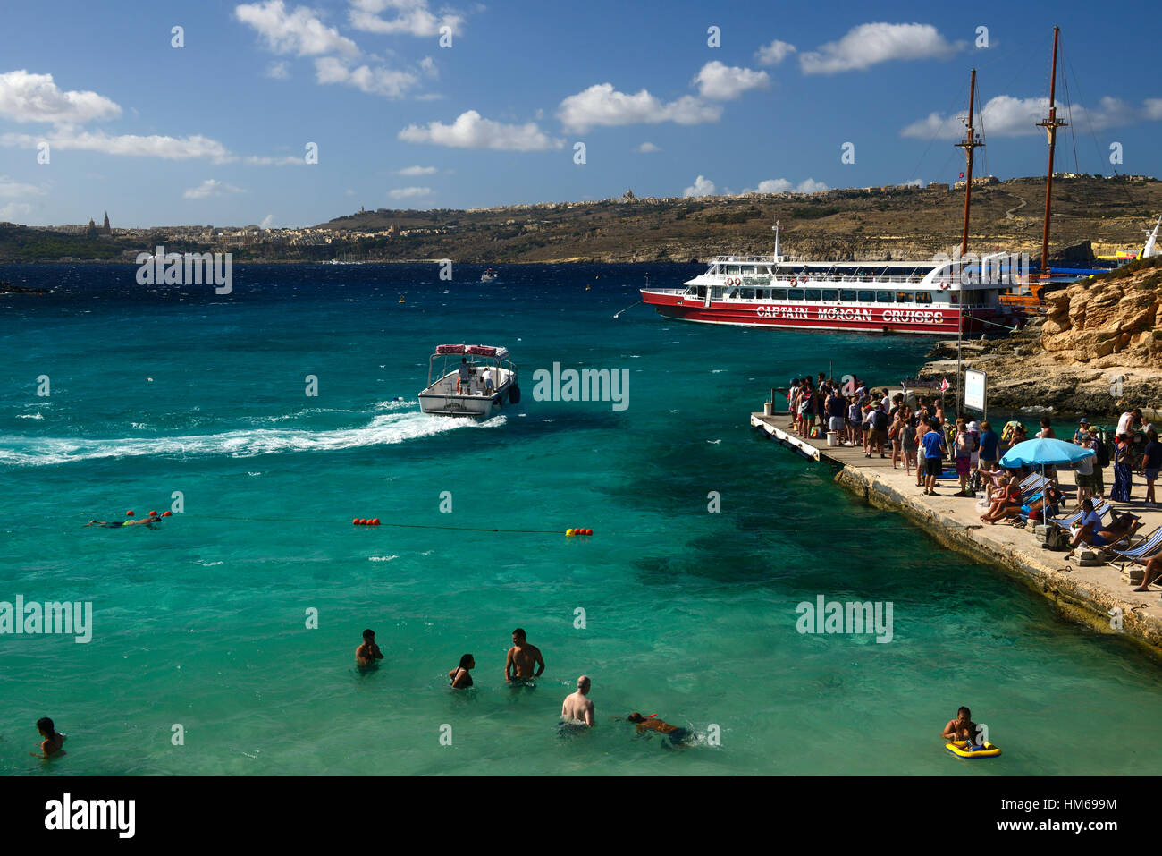 The Blue Lagoon Comino Island azure sea seas sky crystal clear water waters Mediterranean ocean tourism Malta RM World Stock Photo