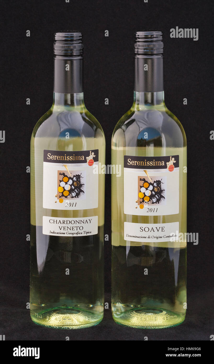 KIEV, UKRAINE - AUGUST 26, 2012: Bottles of Italian wine Serenissima Chardonnay Veneto and Soave against black background. The Veneto alone produces m Stock Photo