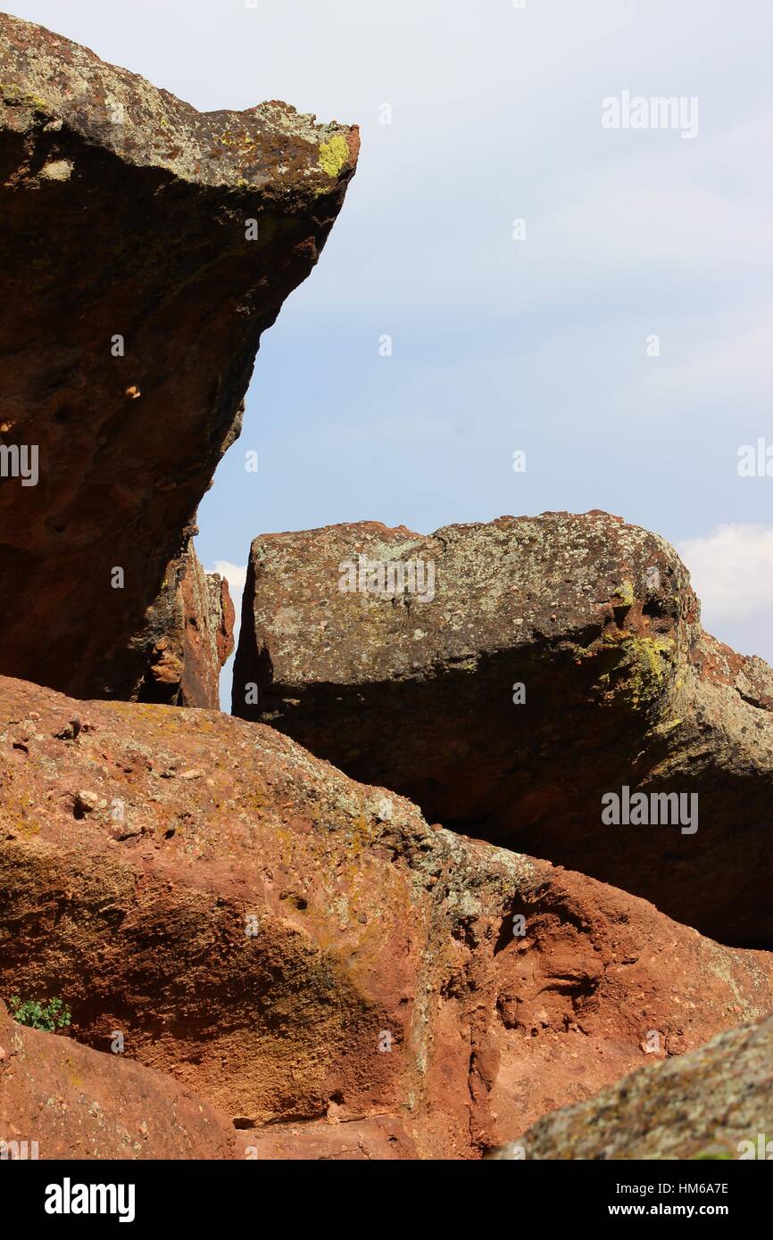 Red rock juts from the ground. Stock Photo