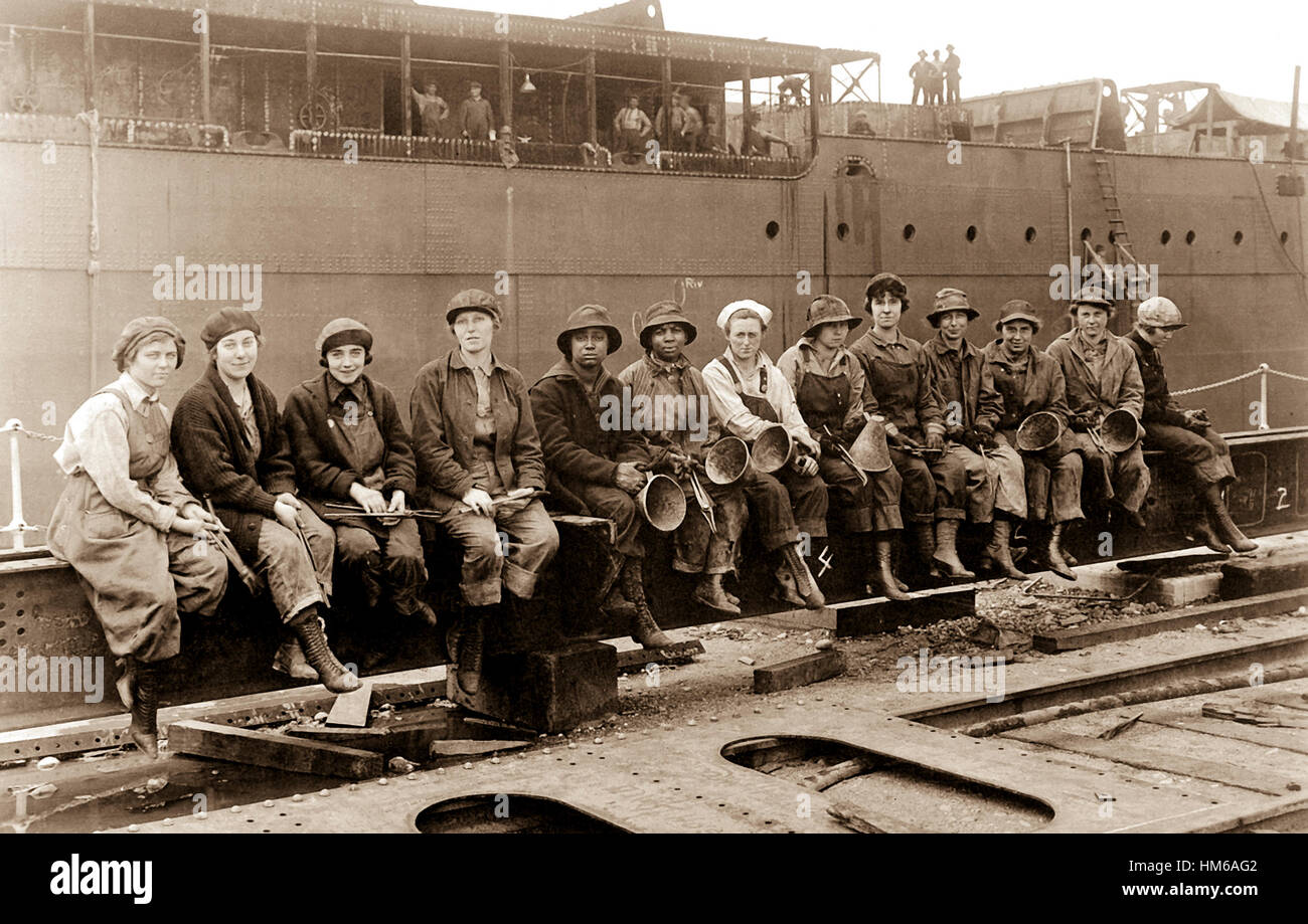 Women Rivet Heaters and Passers on, Ship Construction Work. Navy Yard