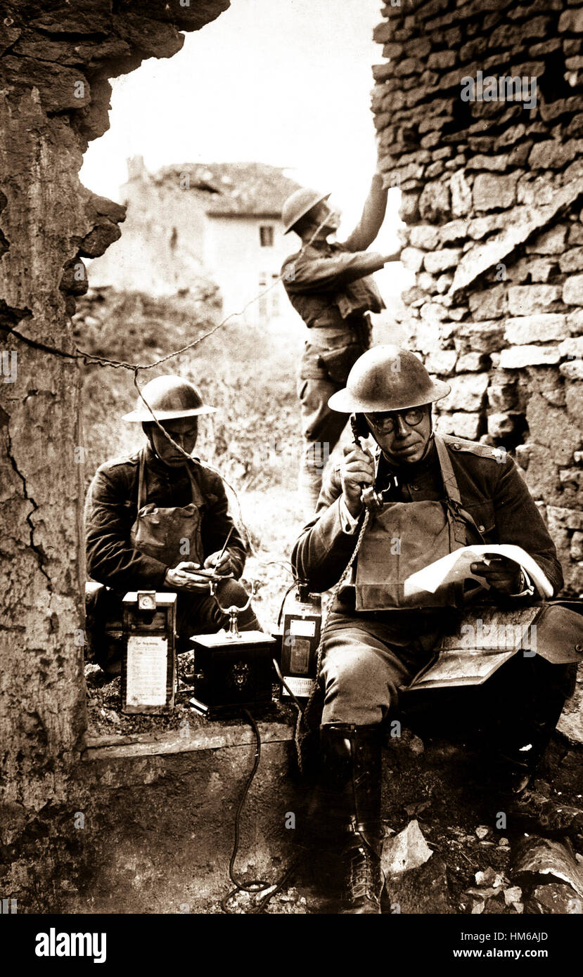 Lieut. Col. R. D. Garrett, chief signal officer, 42nd Division, testing a telephone left behind by the Germans in the hasty retreat from the salient of St. Mihiel.  Essey, France.  September 19, 1918.  Cpl. R. H. Ingleston.  (Army) NARA FILE #:  111-SC-23112 WAR & CONFLICT BOOK #:  617 Stock Photo