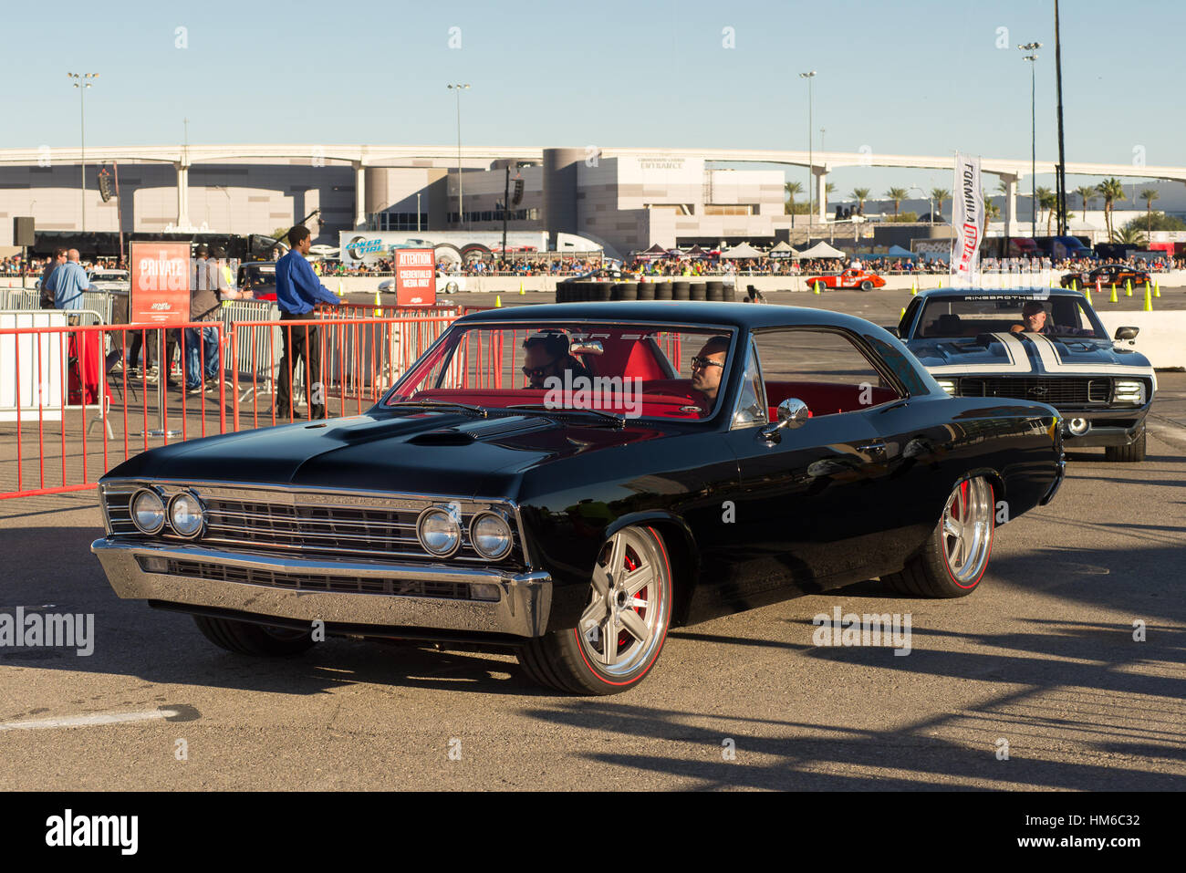 Roadster Shop's 1967 Chevrolet Chevelle followed by the Ringbrothers 1969 Camaro cars at SEMA. Stock Photo