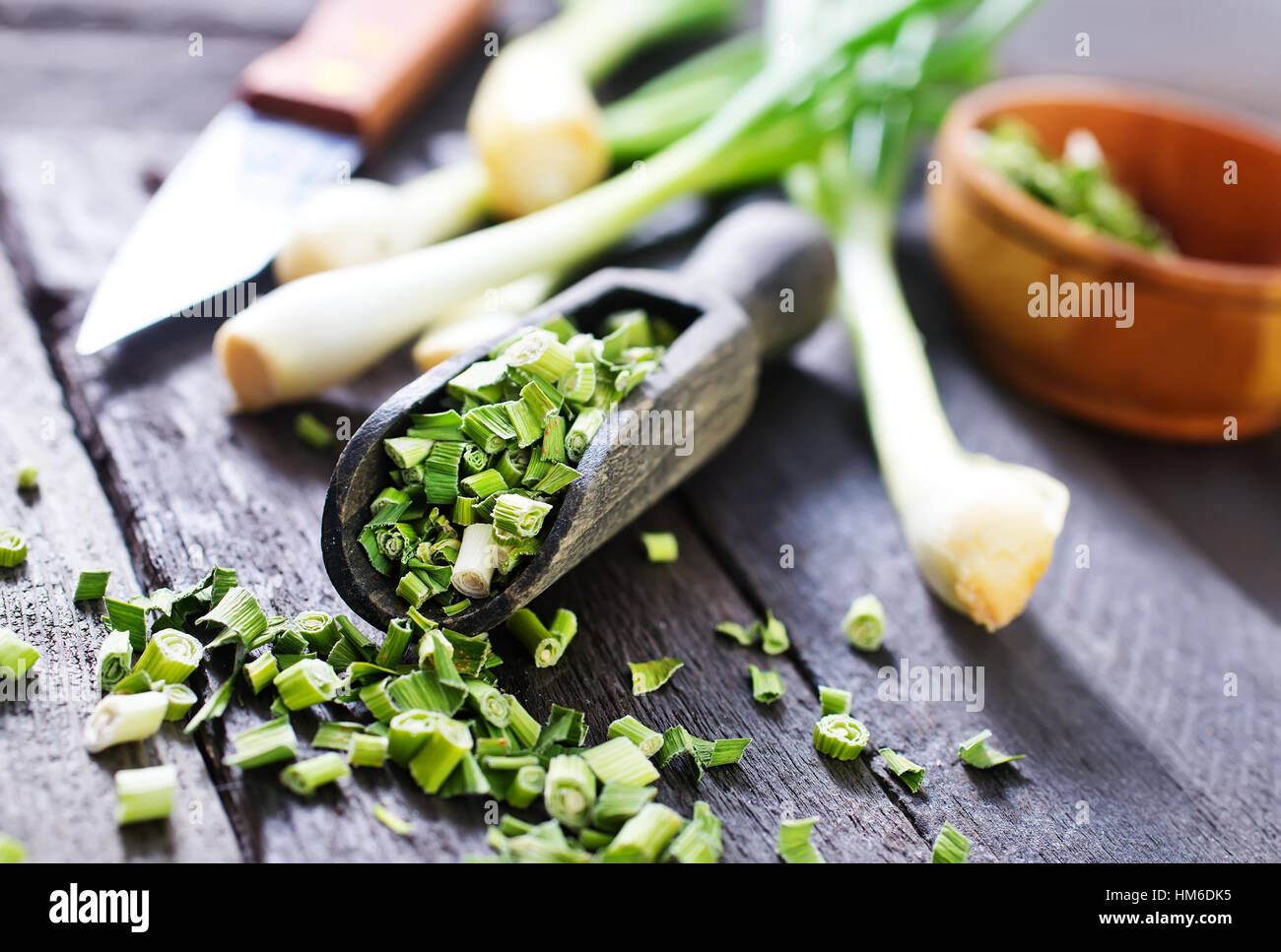 dry green onion and knife on a table Stock Photo - Alamy