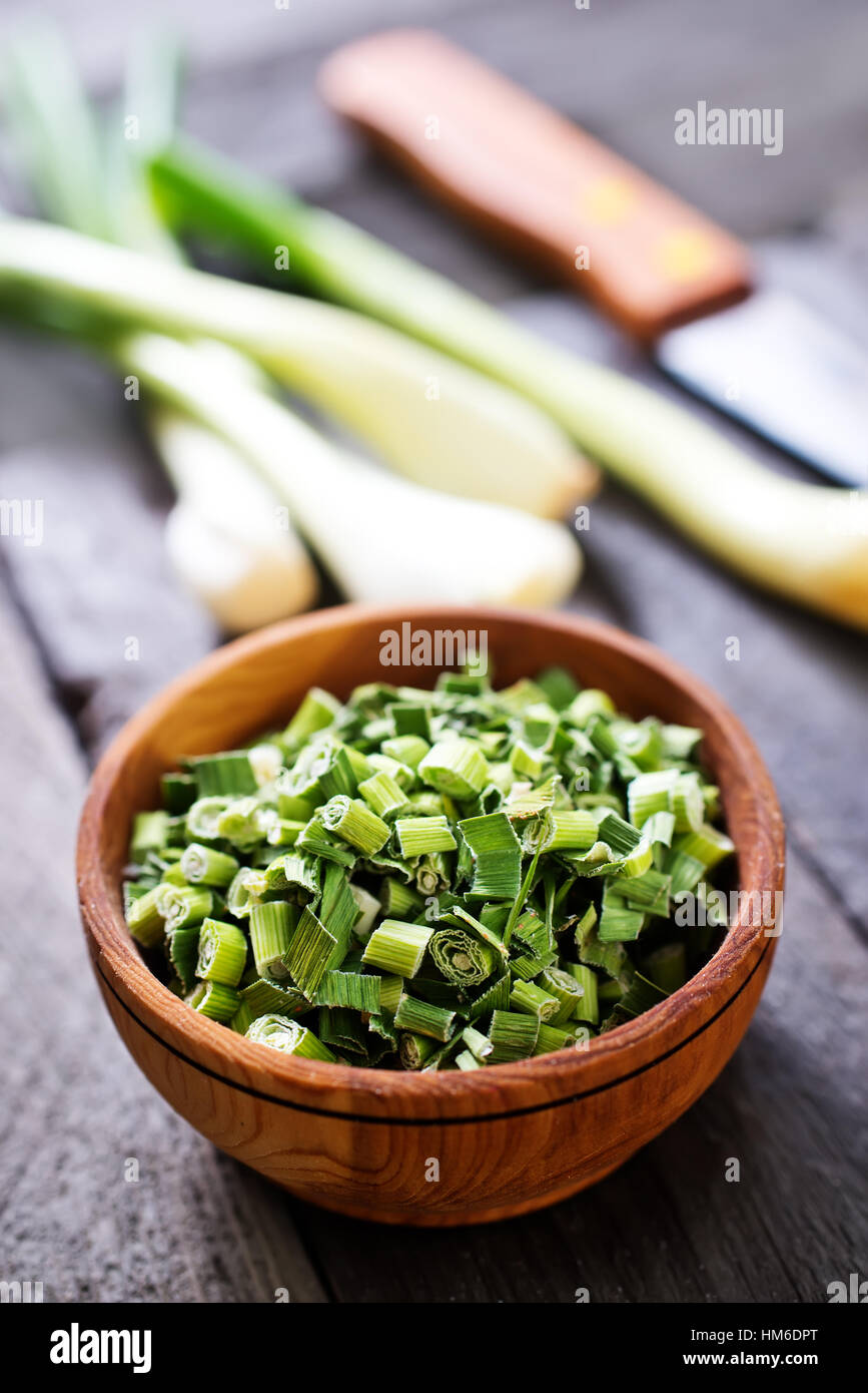 dry green onion and knife on a table Stock Photo - Alamy