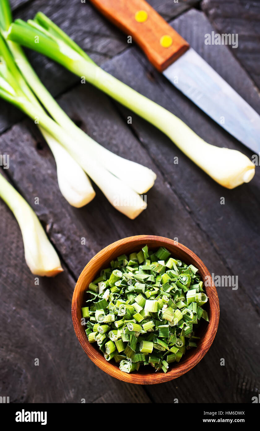 dry green onion and knife on a table Stock Photo - Alamy