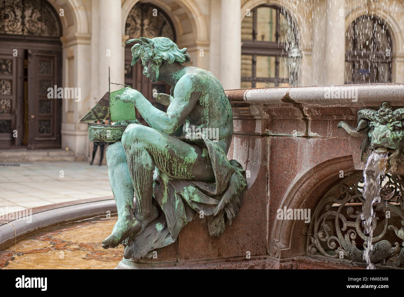 Detail of bronze statue on the fountain in the old city hall of Hamburg Stock Photo