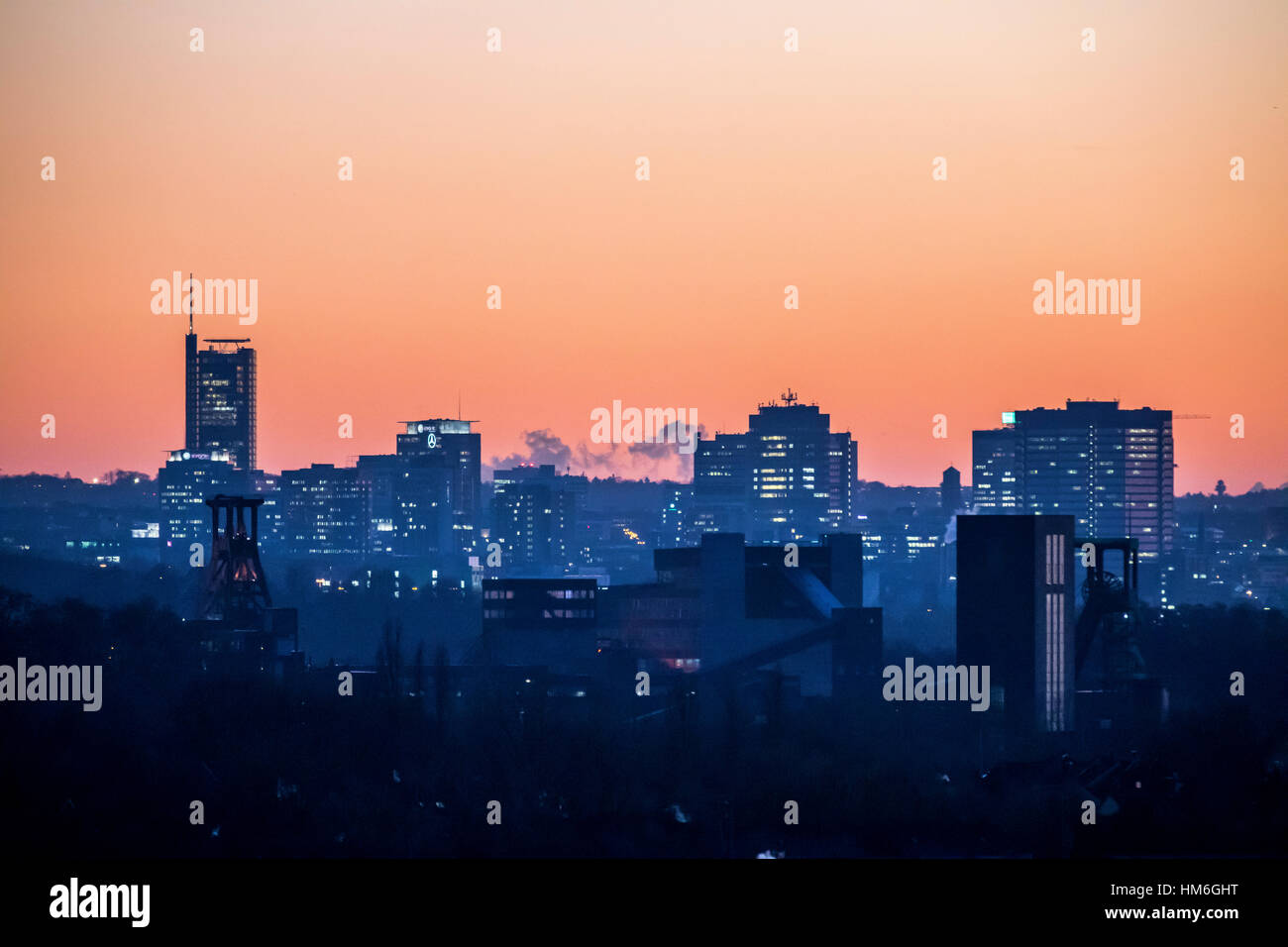 Skyline of Essen, in front the Zollverein colliery, world cultural heritage, behind the skyscrapers of the inner city, with the town hall, right, RWE  Stock Photo