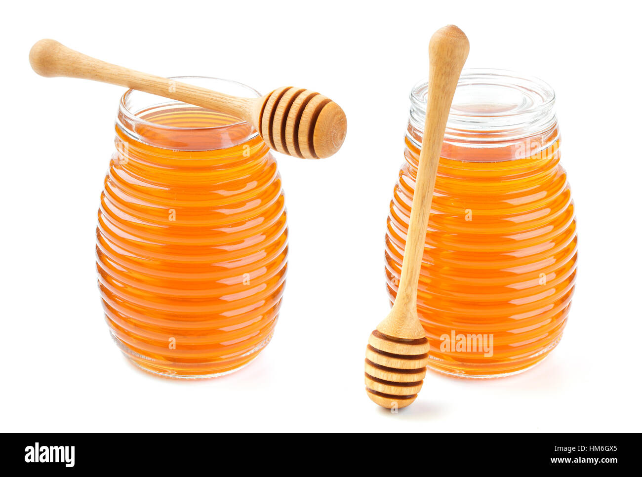 Honey in glass jar isolated on white background Stock Photo Alamy