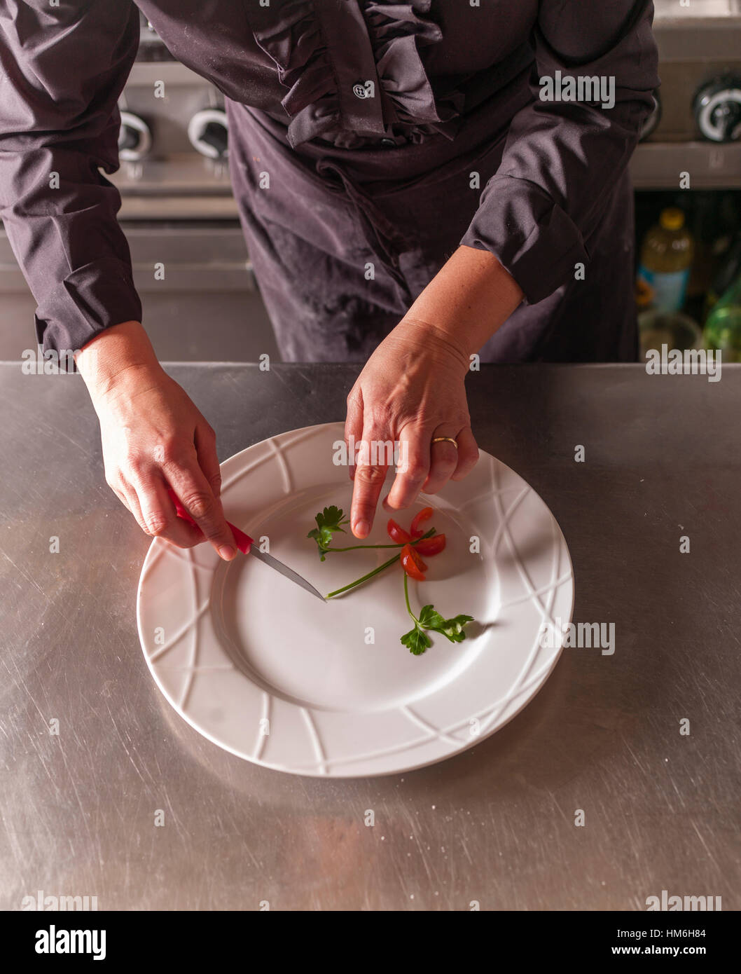 Chef Marina Morelli cooking in her restaurant Hosteria 700, Cremona