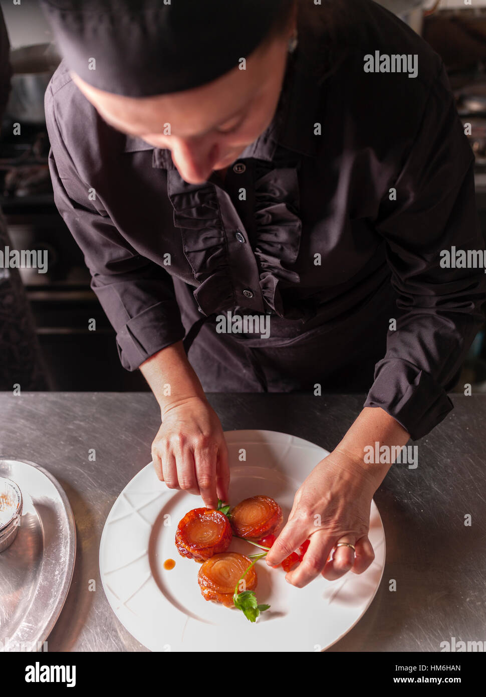 Chef Marina Morelli cooking in her restaurant Hosteria 700, Cremona