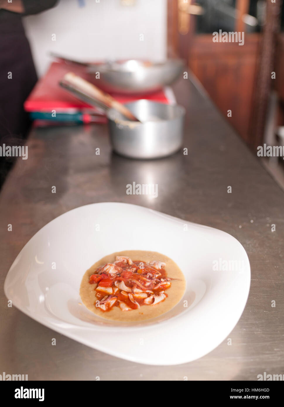 Chef Marina Morelli cooking in her restaurant Hosteria 700, Cremona