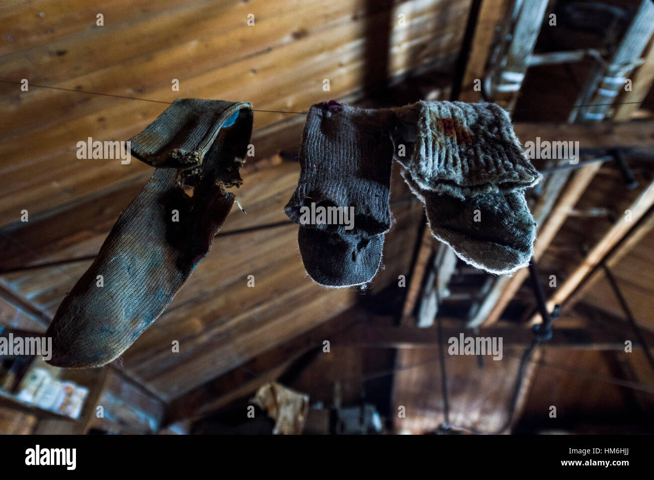 Woolen socks hanging from a clothes line in Antarctic explorer Ernest Shackelton's hut. Stock Photo