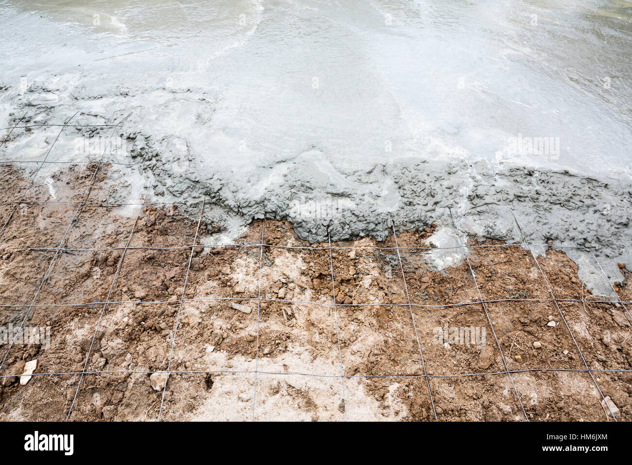 Wet cement concrete for new floor Stock Photo