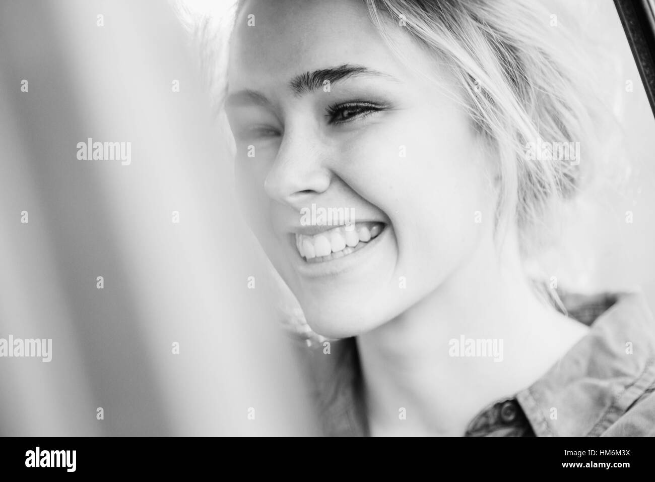 young smiling woman in a car Stock Photo - Alamy