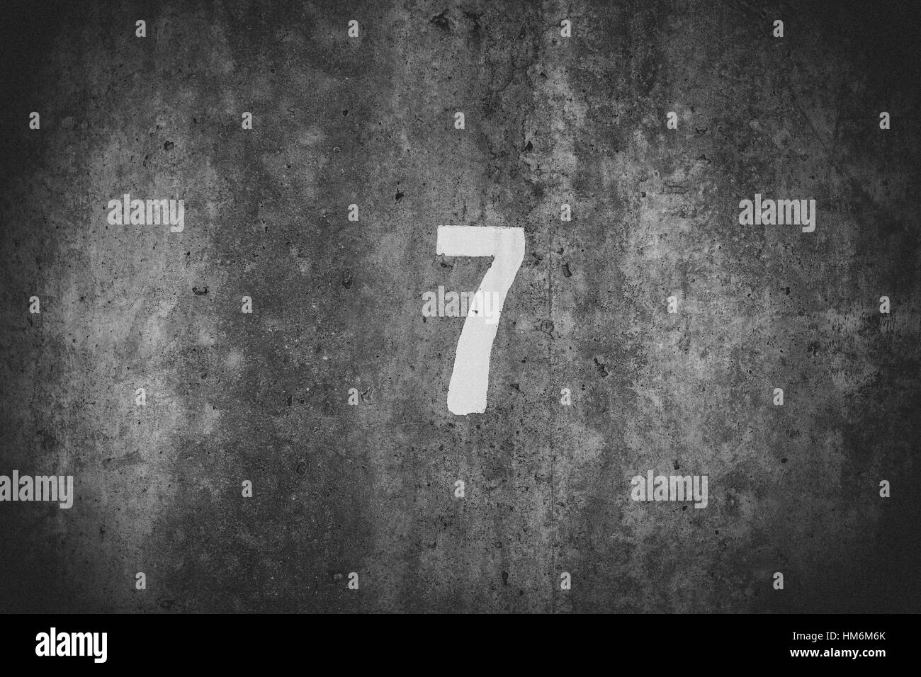 number 7 on concrete wall Stock Photo