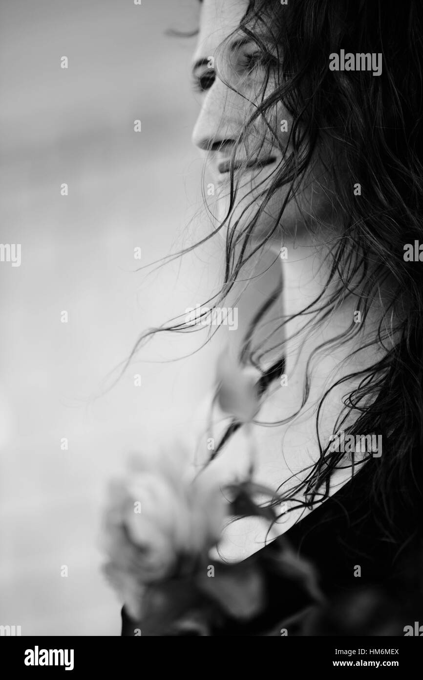 young woman looks in a good mood in the distance Stock Photo