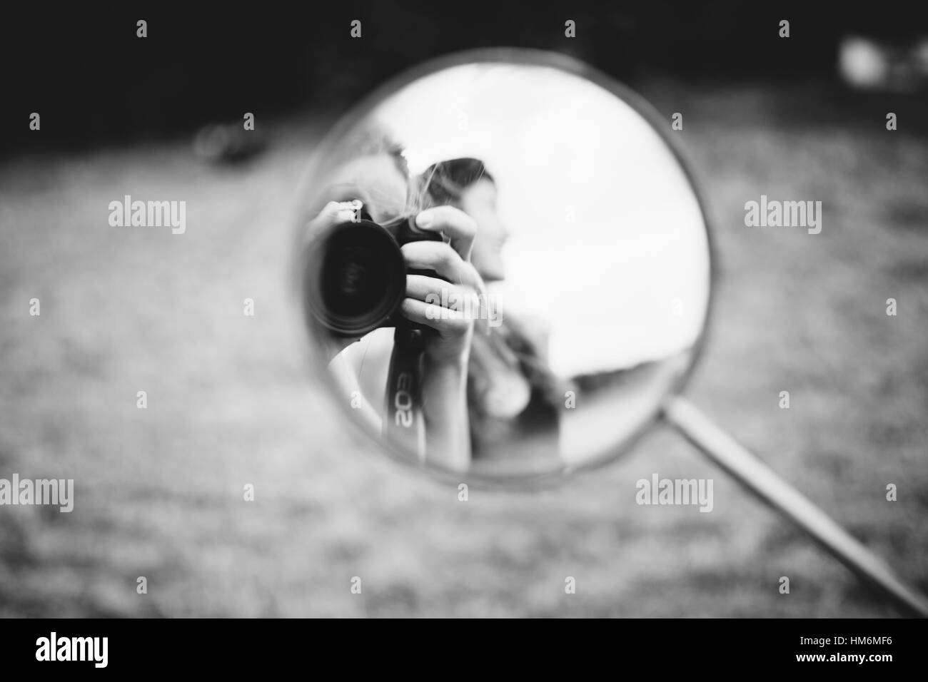 Woman in motorcycle mirror hi-res stock photography and images - Alamy