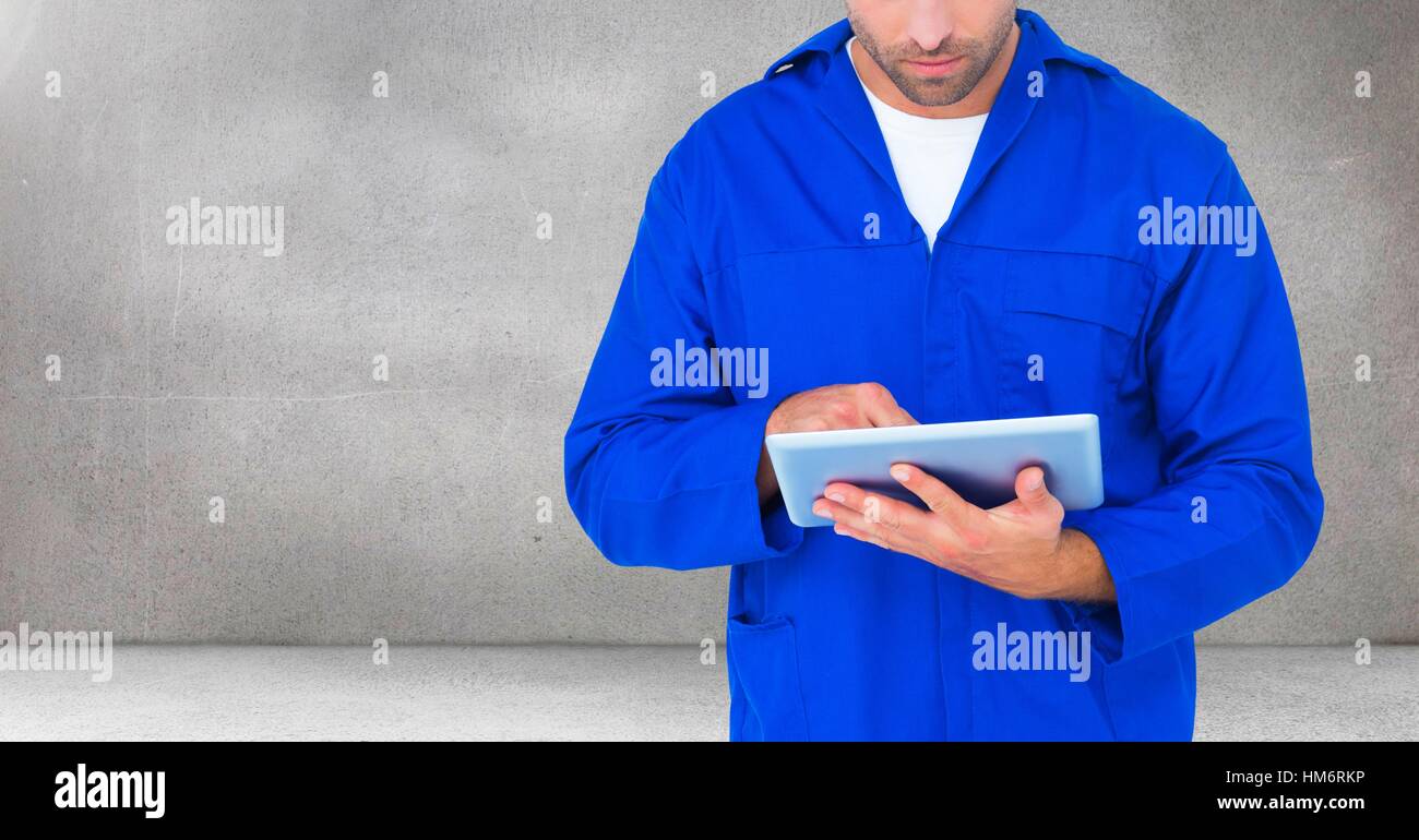 Serviceman using digital tablet Stock Photo