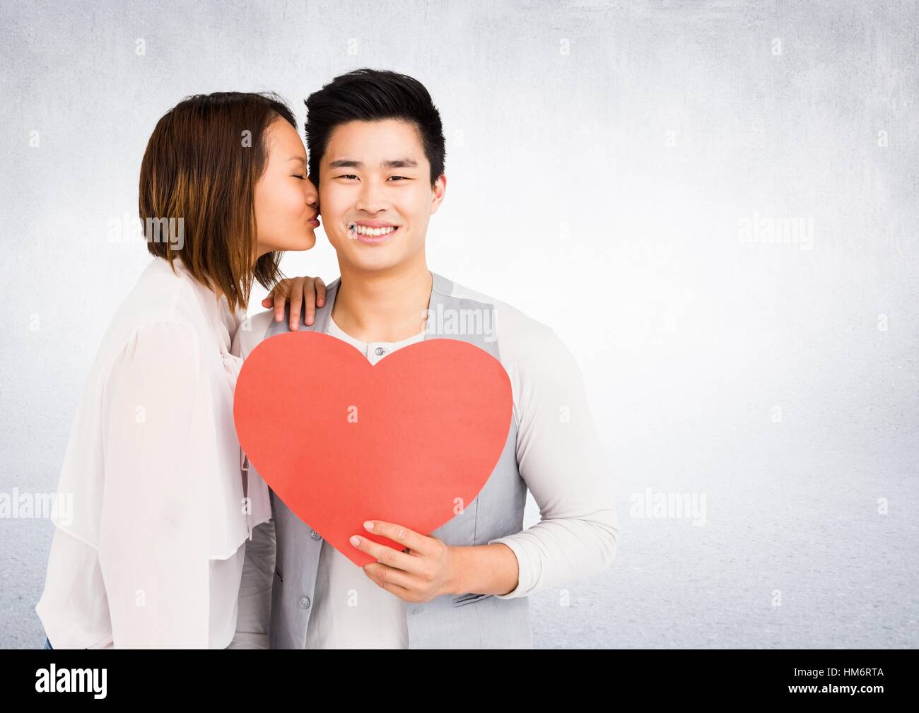 Romantic couple holding heart shape Stock Photo - Alamy