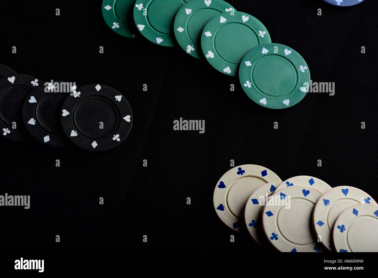 gamble colour chips lay on black table Stock Photo