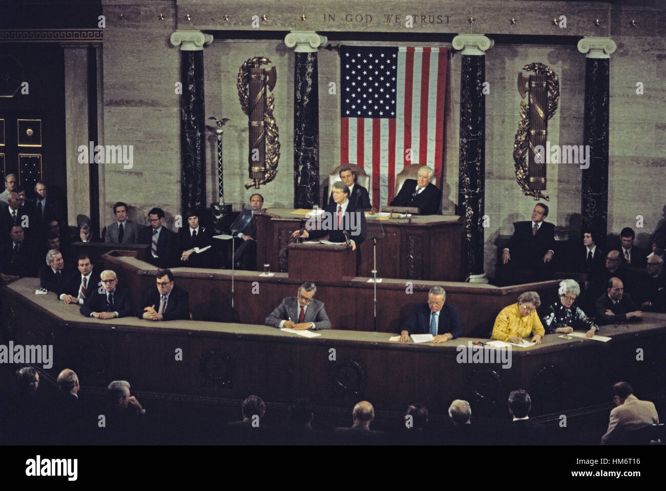 United States President Jimmy Carter presents his National Energy Plan to a joint session of the US Congress in the US Capitol in Washington, DC on April 20, 1977. Seated behind the President are US Vice President Walter Mondale, left, and the Speaker of Stock Photo