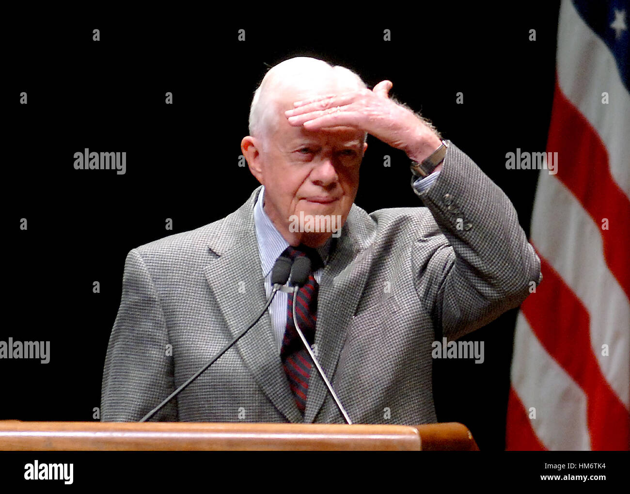 Washington, D.C. - March 8, 2007 -- Former United States President Jimmy Carter shields his eyes from the bright lights while listening to a student's question concerning his controversial book 'Palestine: Peace Not Apartheid' during an appearance at Geor Stock Photo