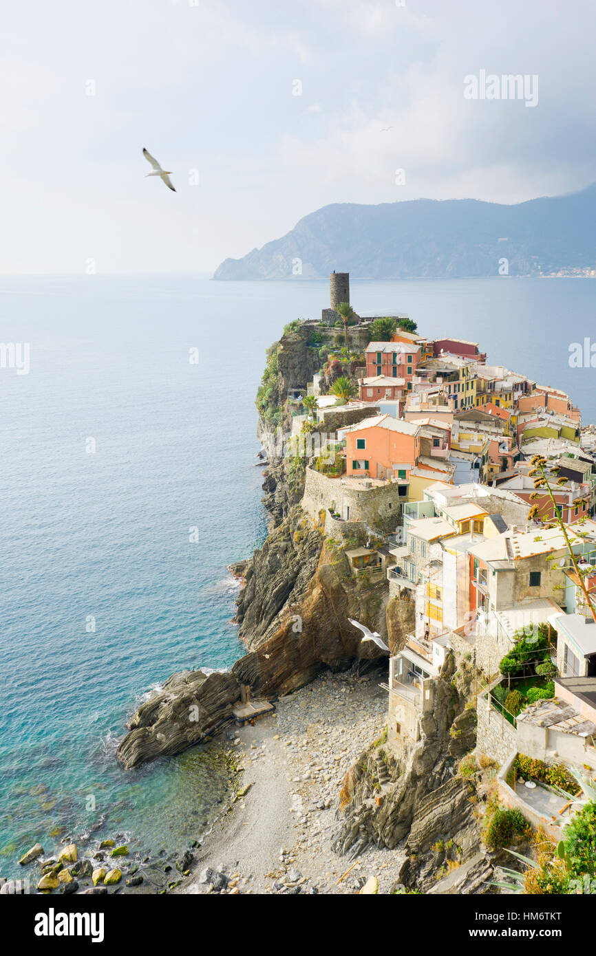 high-angle-view-of-town-by-sea-against-cloudy-sky-at-cinque-terre-stock
