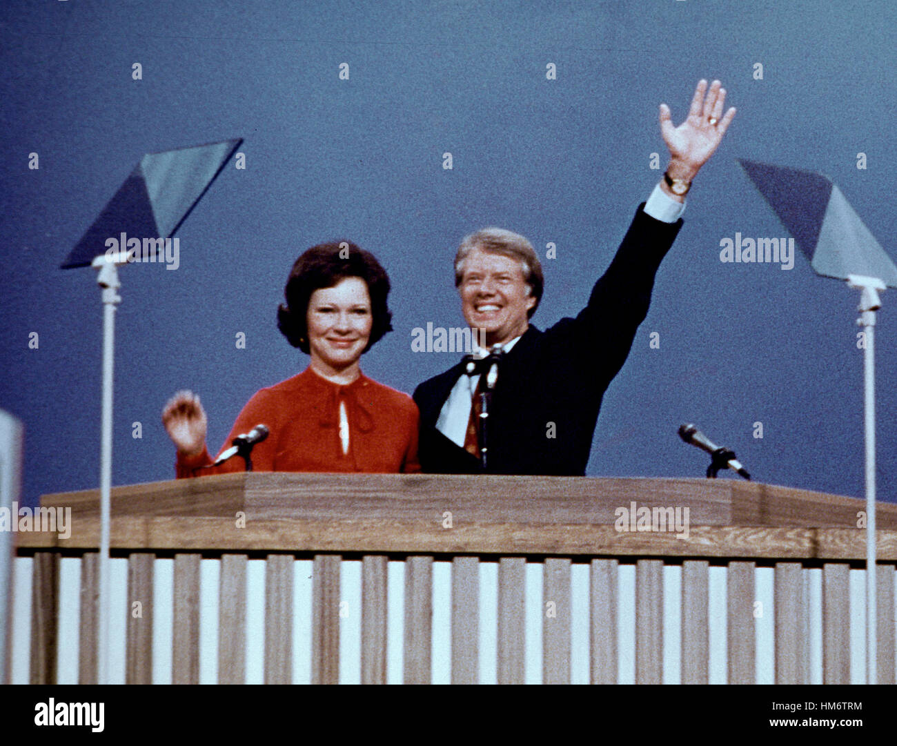 Governor Jimmy Carter (Democrat of Georgia), the 1976 Democratic Party nominee for President of the United States, right, and his wife Rosalynn Carter, left, acknowledge the cheers of the delegates following their acceptance speeches at the 1976 Democrati Stock Photo