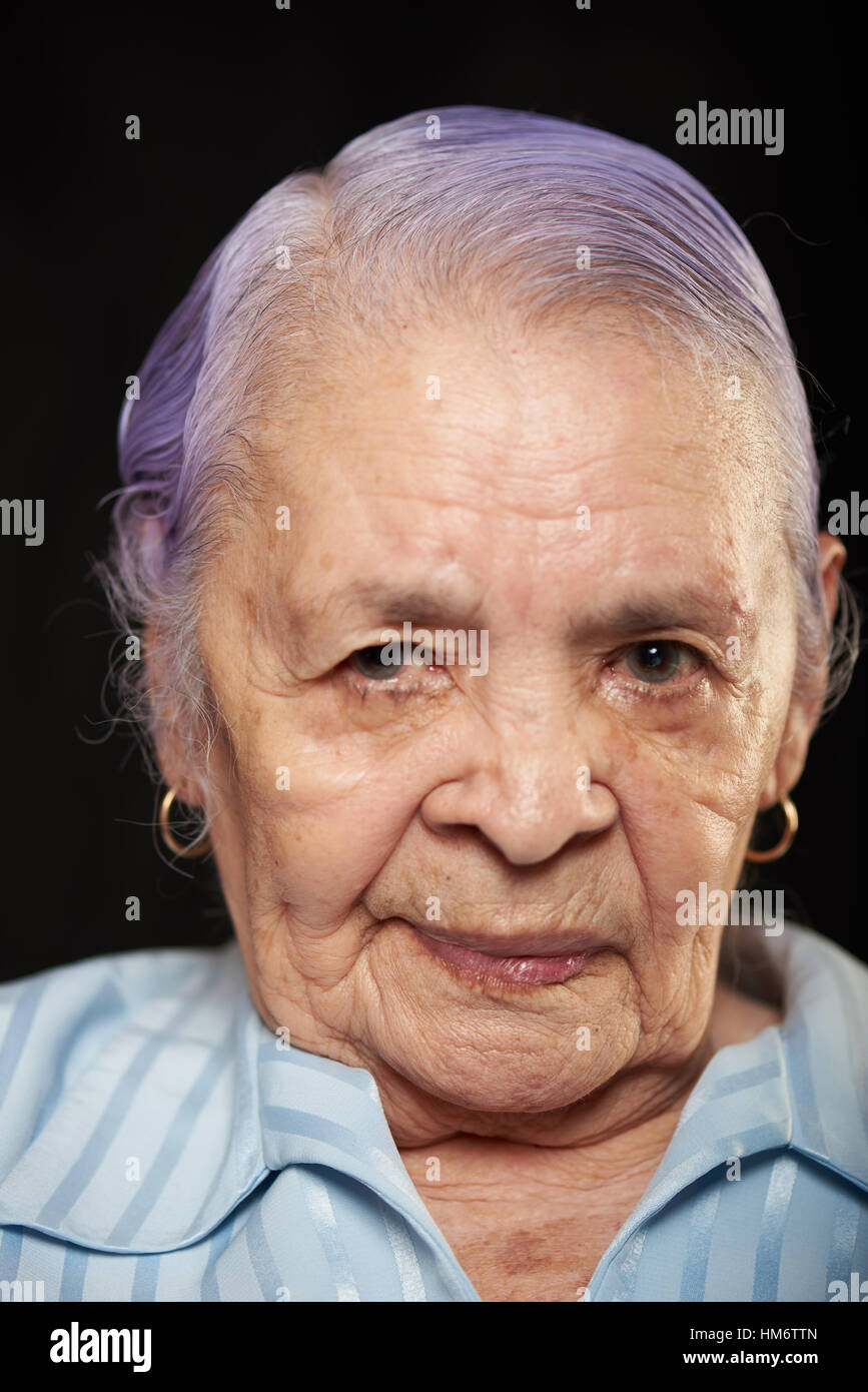 old grumpy grandma isolated on black background Stock Photo