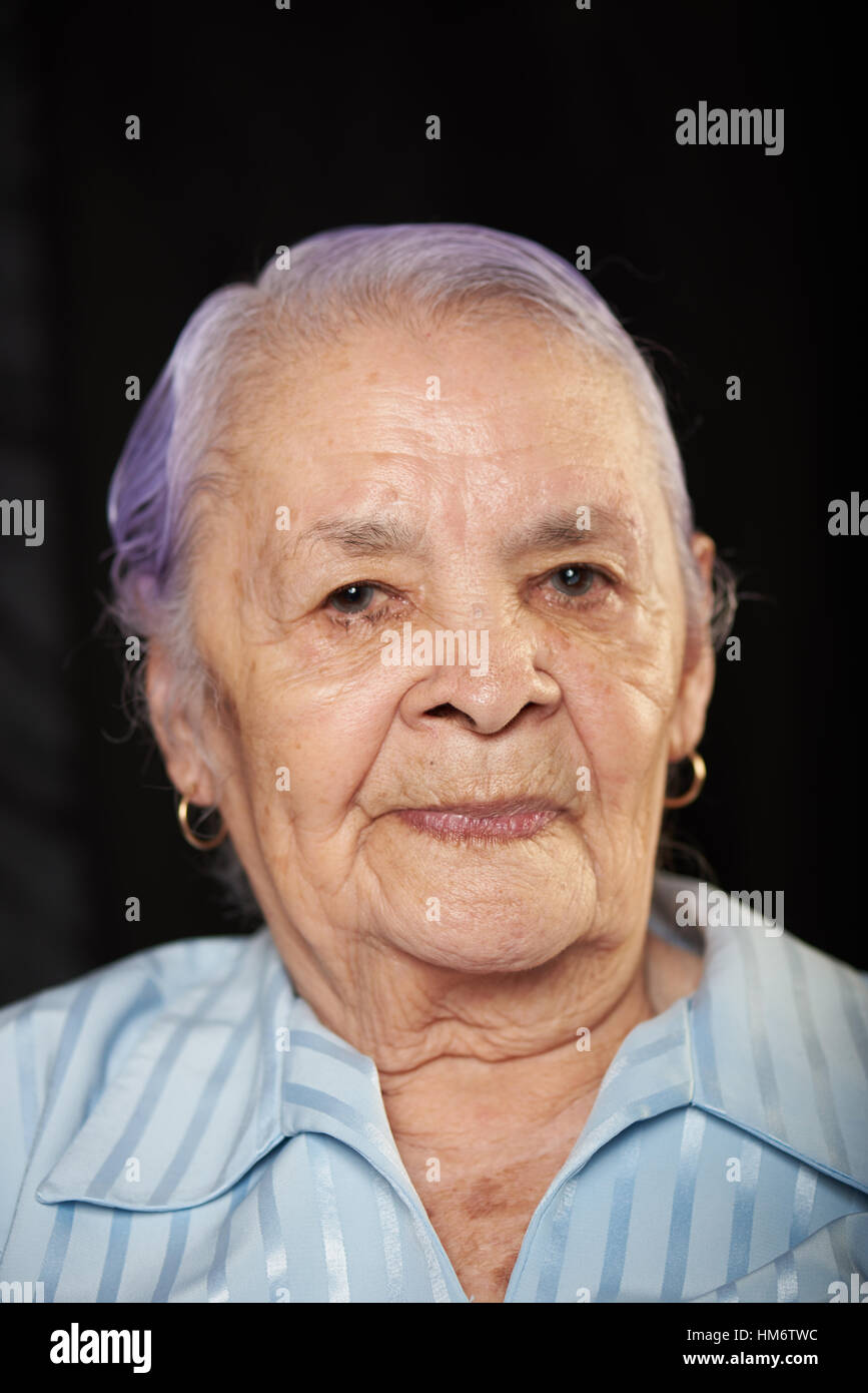 Portrait of old grandma isolated on black background Stock Photo