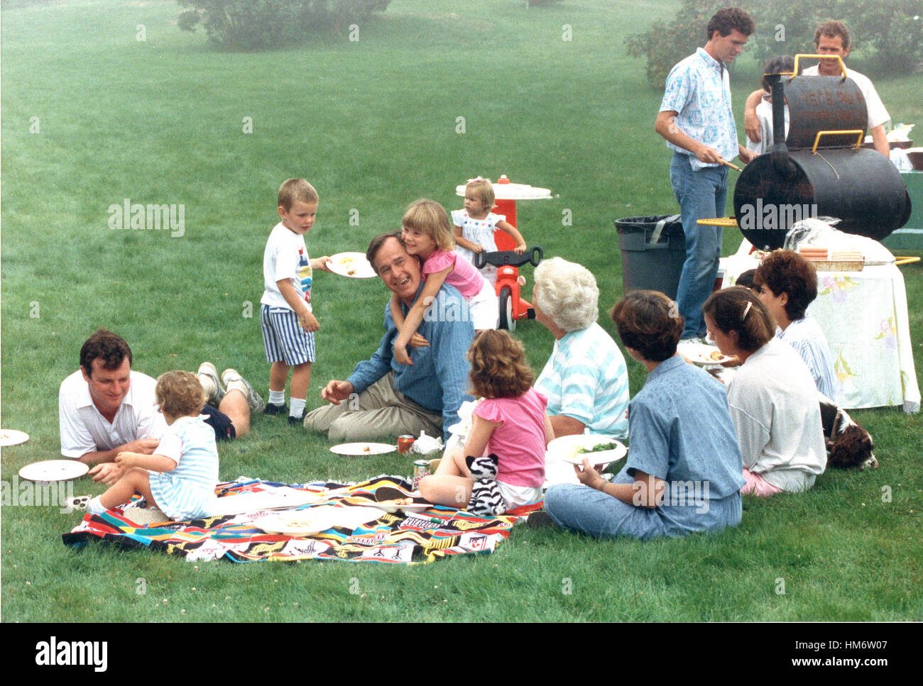 Kennebunkport, Maine - August 7, 1988 -- United States Vice President George H.W. Bush is surrounded by his children and grandchildren at the family home in Kennebunkport, Maine on August 7, 1988. Future United States President George W. Bush is at the up Stock Photo