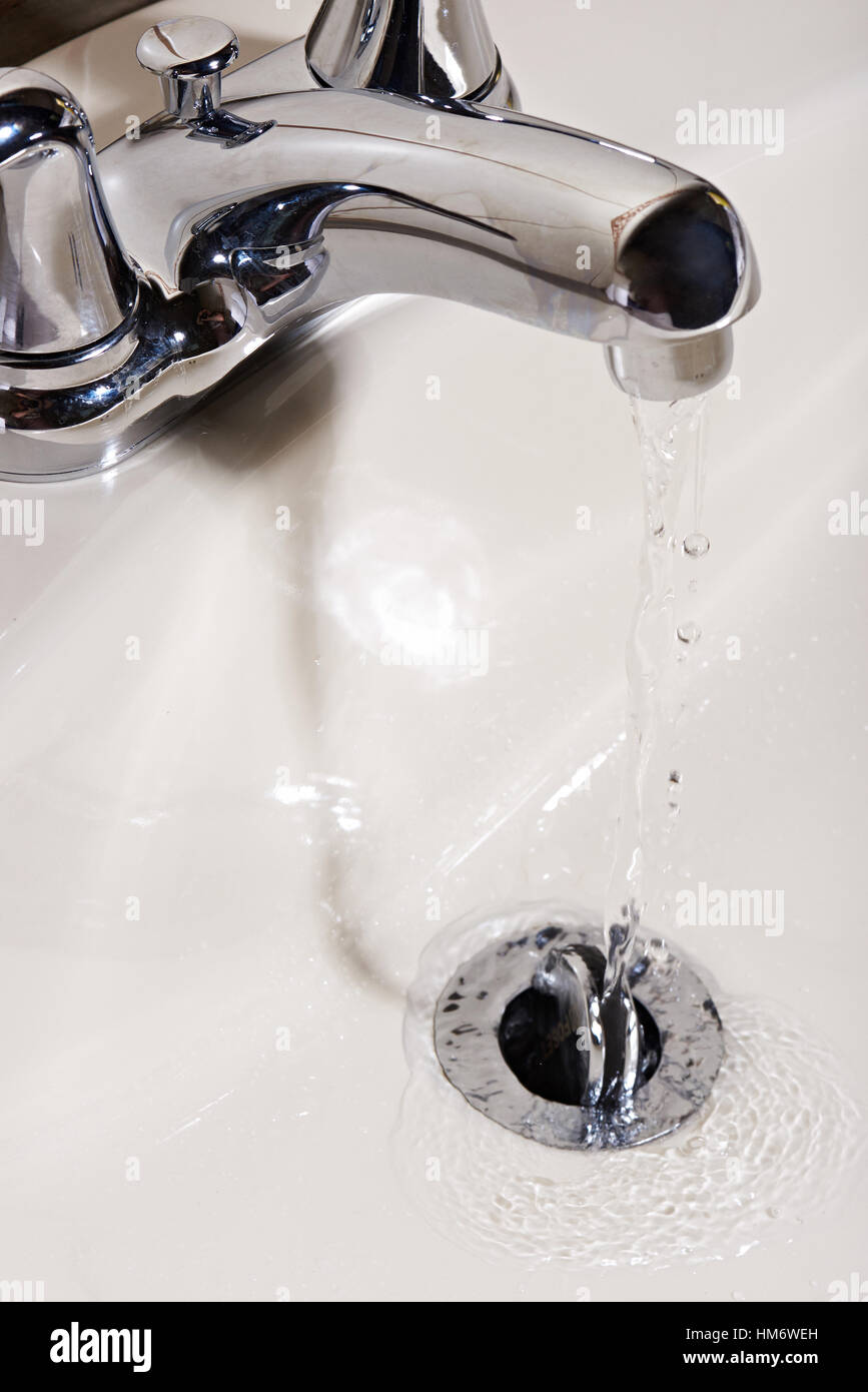 close up of clear water run from modern tap Stock Photo