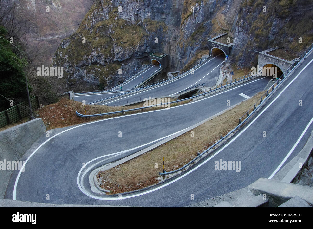 The curvy road of San Boldo pass is carved in the rocks and so narrow that only a car at a time can pass. Stock Photo