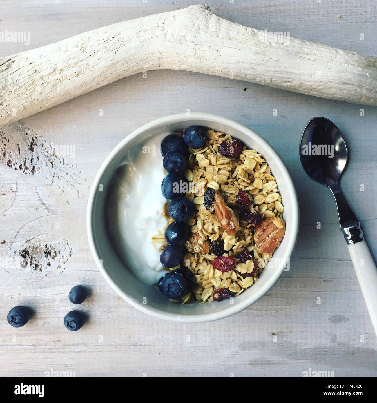 Overhead view of granola in bowl on table Stock Photo