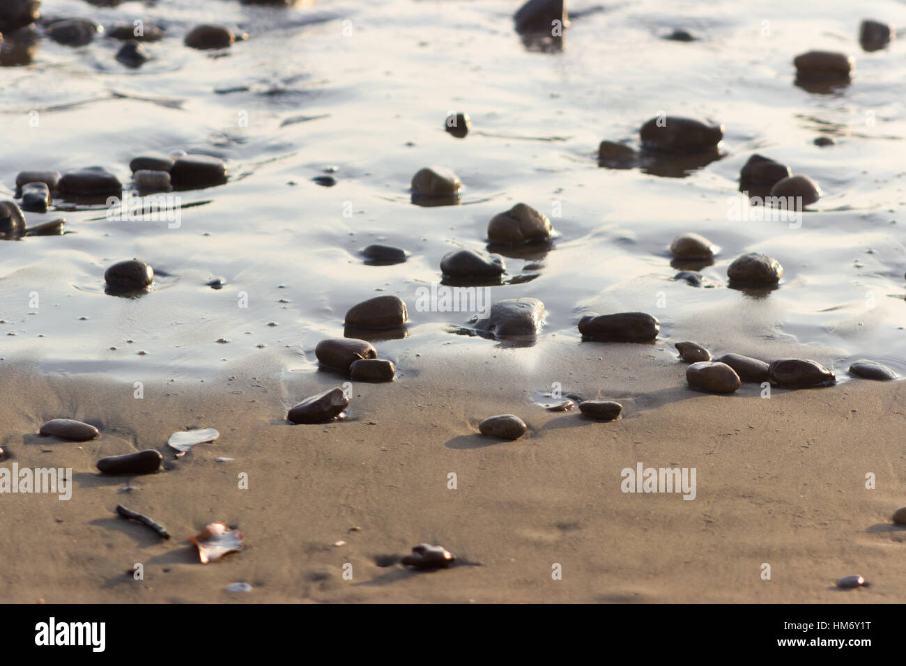 Pebbles in the sand at Playa Hermosa near Uvita, Costa Rica. Stock Photo
