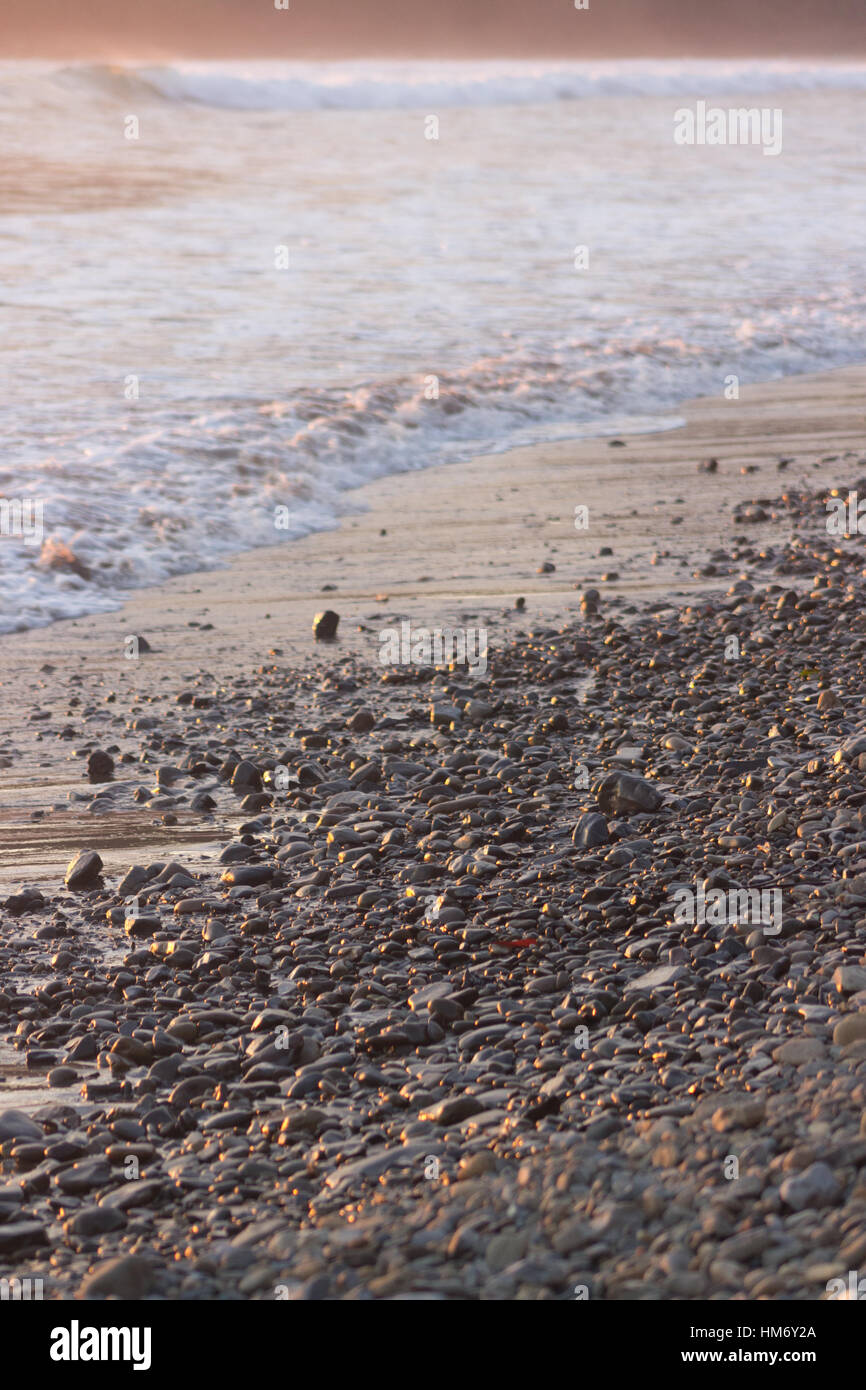 Pebbles in the sand at Playa Hermosa near Uvita, Costa Rica. Stock Photo